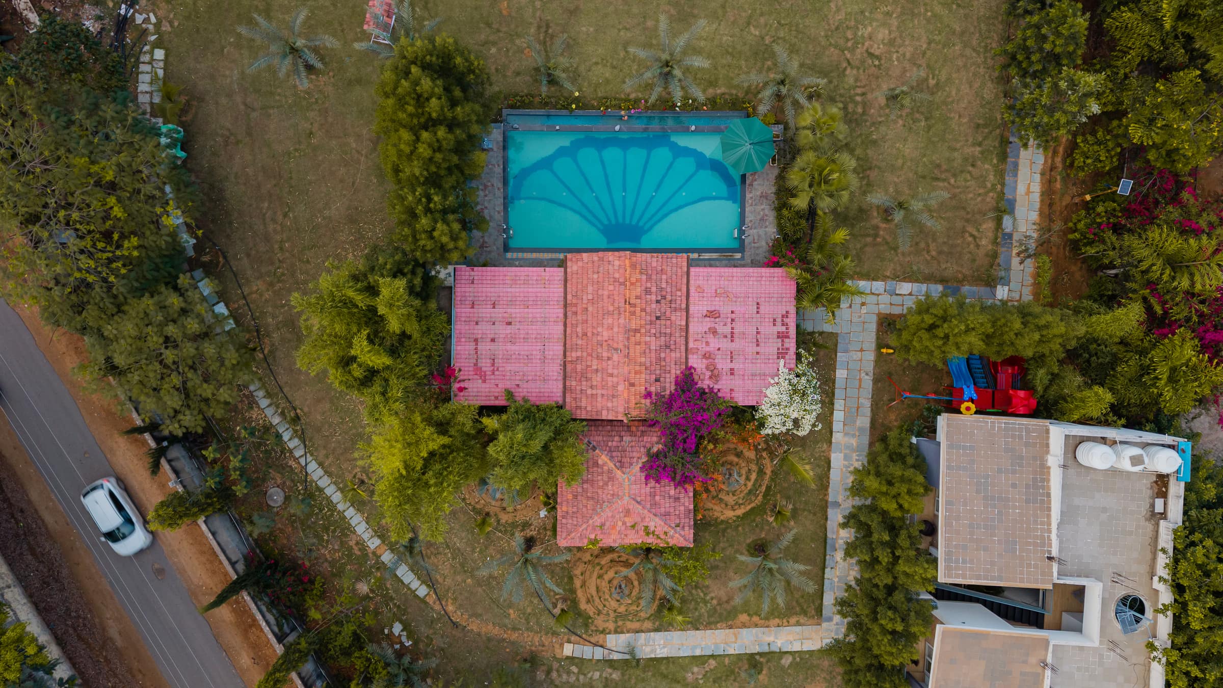 Aerial view of the Oasis Pool, its floor tiled with a giant oyster-shell mosaic